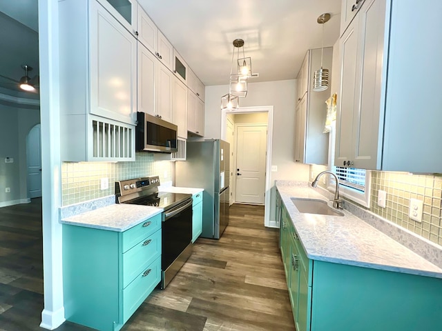 3102 Cutter Ct, Greenbackville, VA 23356 - kitchen featuring appliances with stainless steel finishes, tasteful backsplash, dark wood-style flooring, glass insert cabinets, and ceiling fan