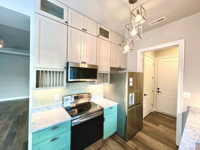 3102 Cutter Ct, Greenbackville, VA 23356 - kitchen with appliances with stainless steel finishes, dark wood-type flooring, backsplash, glass insert cabinets, and hanging light fixtures