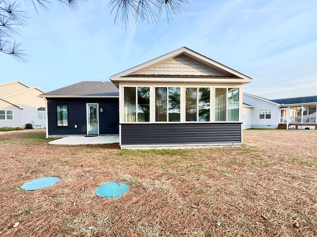3102 Cutter Ct, Greenbackville, VA 23356 - rear view of house featuring a patio area, a sunroom, and a yard