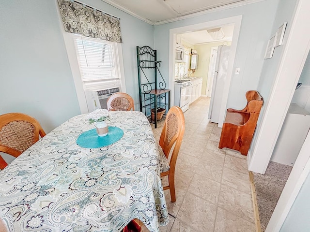 dining room featuring attic access, ornamental molding, and cooling unit