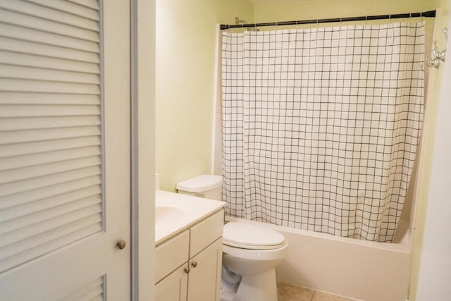 full bath featuring toilet, tile patterned floors, shower / bath combo, and vanity