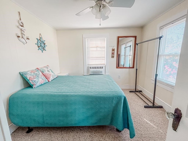 bedroom featuring ceiling fan, crown molding, cooling unit, and baseboards