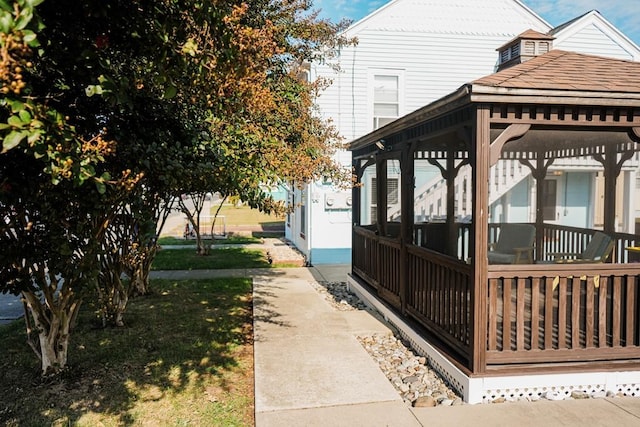 view of side of property with a gazebo