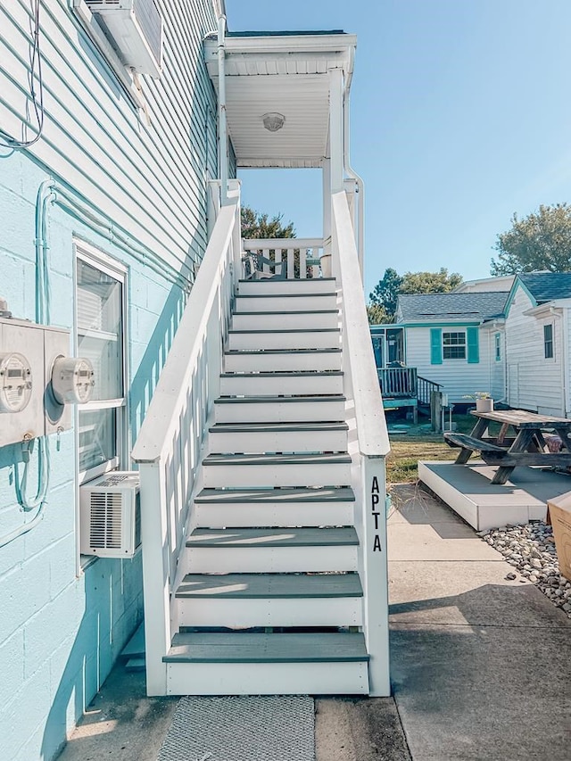 stairway featuring cooling unit