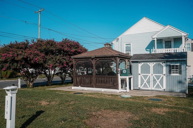 exterior space with an outbuilding, a gazebo, and a storage unit