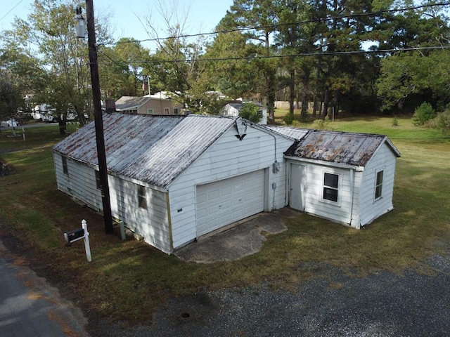 garage with a lawn