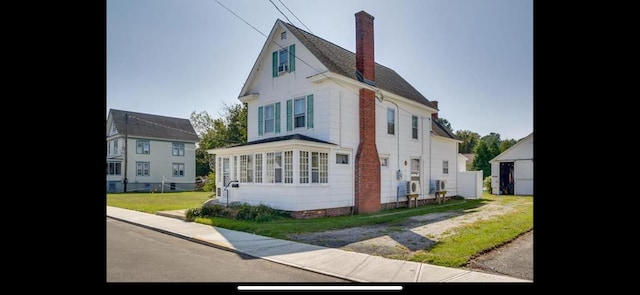 6346 Cropper St, Chincoteague, VA 23336 - view of front of property featuring a chimney