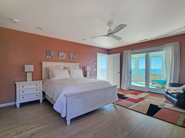 bedroom with baseboards, access to outside, light wood-style flooring, and a ceiling fan