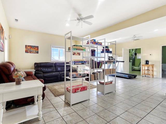 living room featuring ceiling fan, light tile patterned flooring, and visible vents