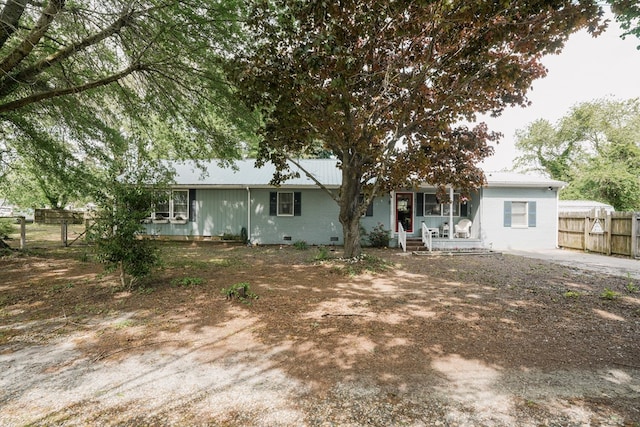 8045 Hickman Farm Ln, Wallops Island, VA 23337 - exterior space with fence and covered porch