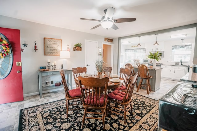 8045 Hickman Farm Ln, Wallops Island, VA 23337 - dining area with baseboards and a ceiling fan