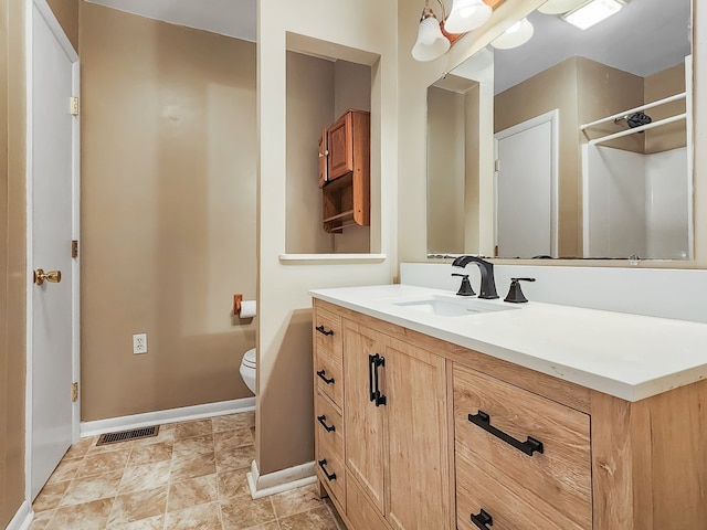 bathroom with vanity and toilet