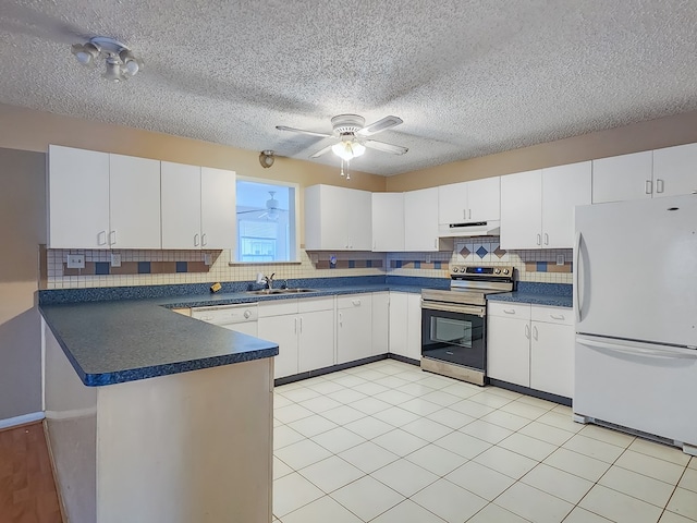 kitchen with sink, white cabinets, and white appliances