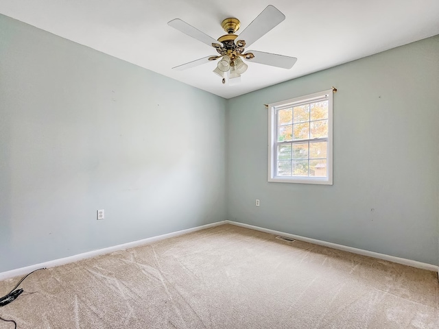 empty room featuring carpet and ceiling fan