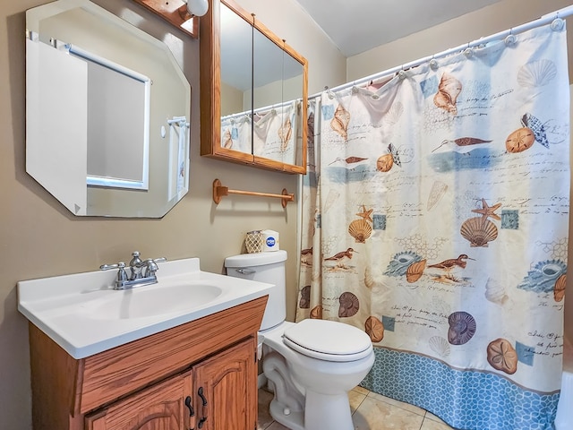 bathroom with tile patterned flooring, vanity, toilet, and a shower with curtain