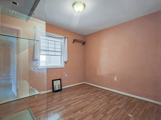 spare room featuring hardwood / wood-style flooring