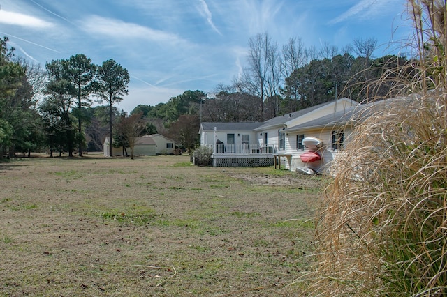 view of yard with a deck