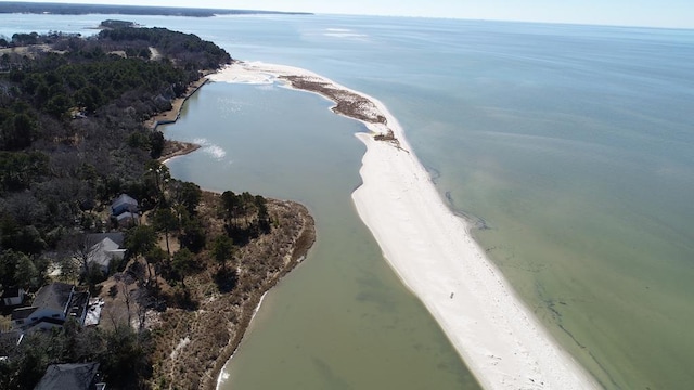 birds eye view of property featuring a beach view and a water view