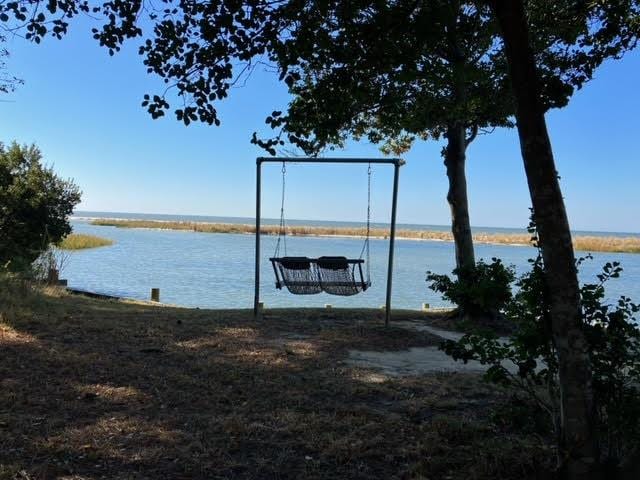 view of dock with a water view