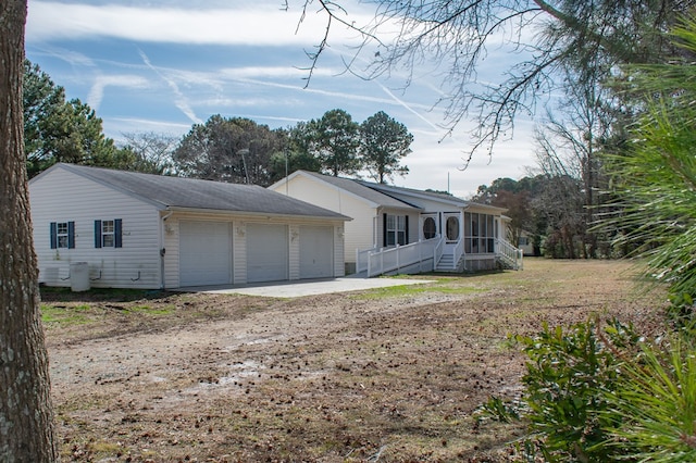 view of front facade with a sunroom and an attached garage