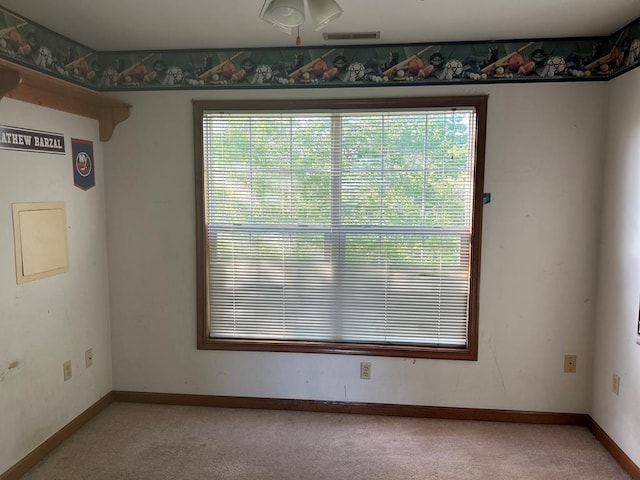 9370 Southwind Rd, Atlantic, VA 23303 - unfurnished dining area featuring light colored carpet and baseboards