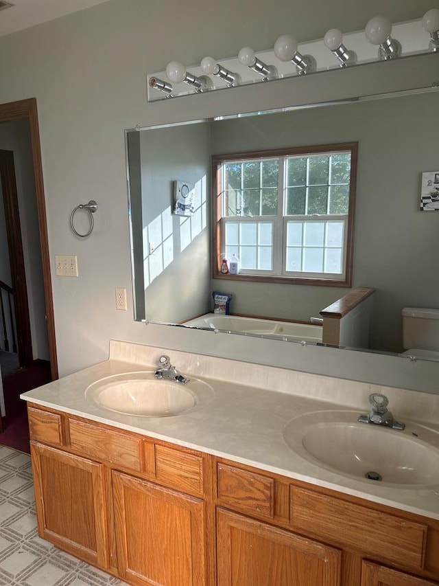 9370 Southwind Rd, Atlantic, VA 23303 - bathroom featuring double vanity and toilet