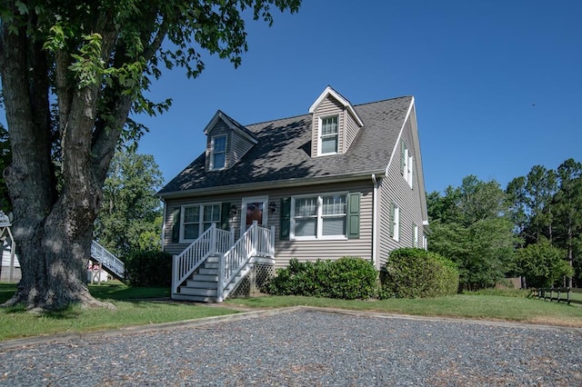 21382 Southside Rd, Onancock, VA 23417 - cape cod house featuring a front yard and a shingled roof
