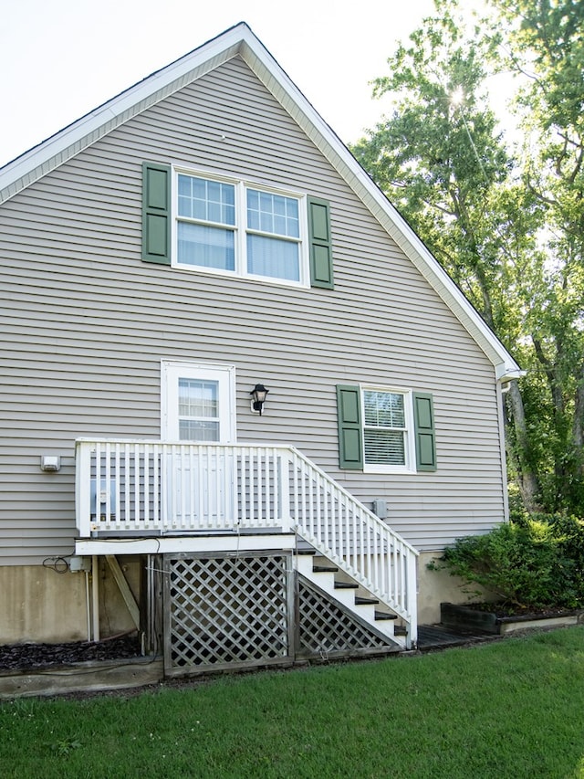 21382 Southside Rd, Onancock, VA 23417 - rear view of property featuring a lawn and a wooden deck