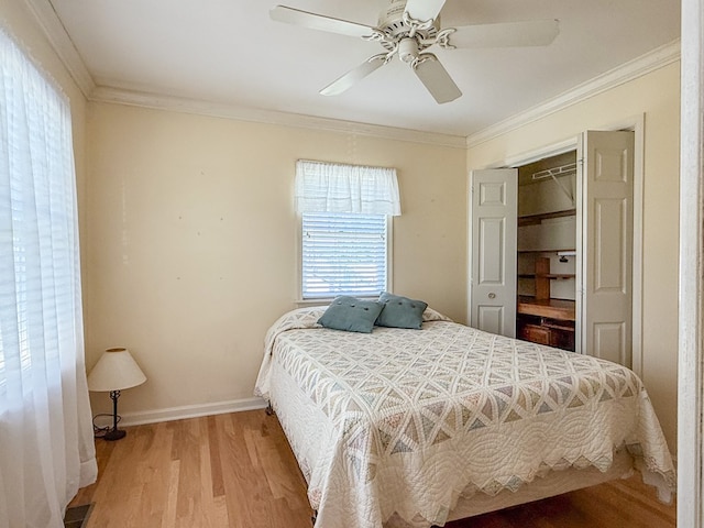 21382 Southside Rd, Onancock, VA 23417 - bedroom featuring light wood-style flooring, ornamental molding, a ceiling fan, and a closet
