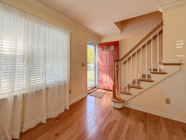 21382 Southside Rd, Onancock, VA 23417 - entryway featuring wood finished floors, ornamental molding, and stairway