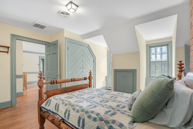 bedroom with light wood-type flooring