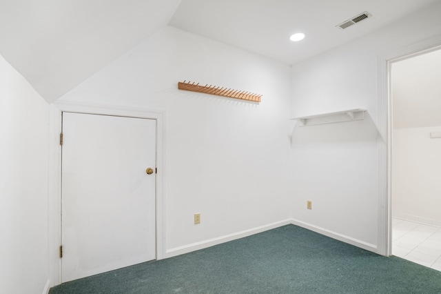 bonus room with lofted ceiling and carpet floors