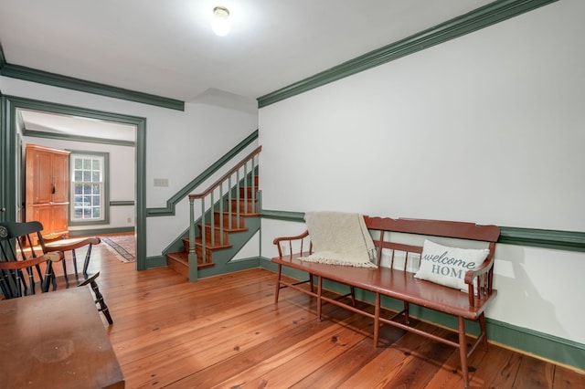 sitting room featuring crown molding and hardwood / wood-style floors