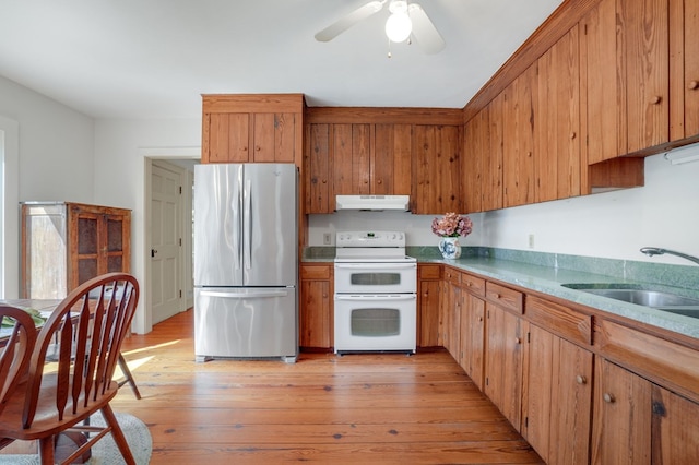 kitchen with stainless steel refrigerator, ceiling fan, sink, white electric range, and light wood-type flooring