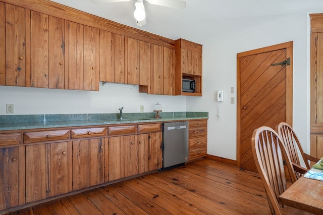 kitchen with dishwasher, ceiling fan, sink, and dark wood-type flooring