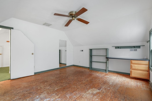 additional living space featuring hardwood / wood-style floors, ceiling fan, and lofted ceiling