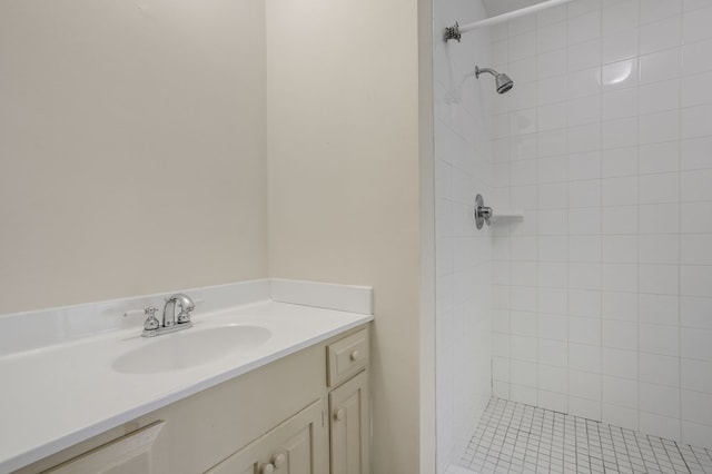 bathroom featuring vanity and a tile shower