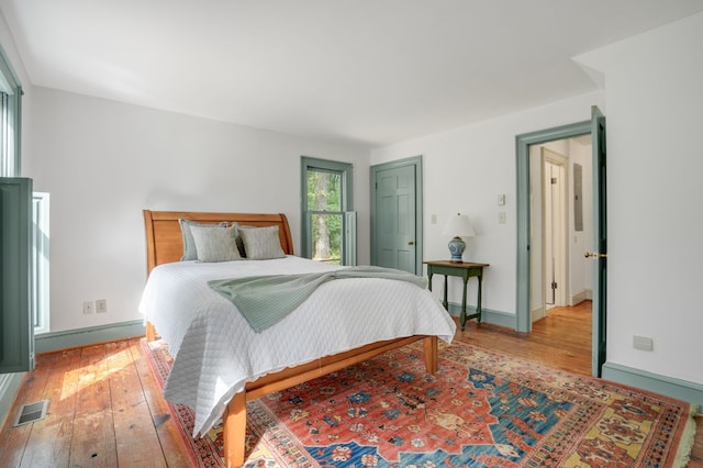 bedroom with wood-type flooring