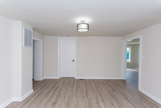 unfurnished room featuring light hardwood / wood-style floors