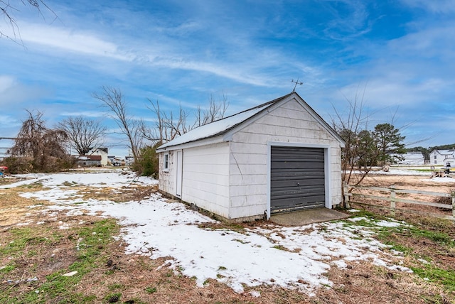 view of snow covered garage