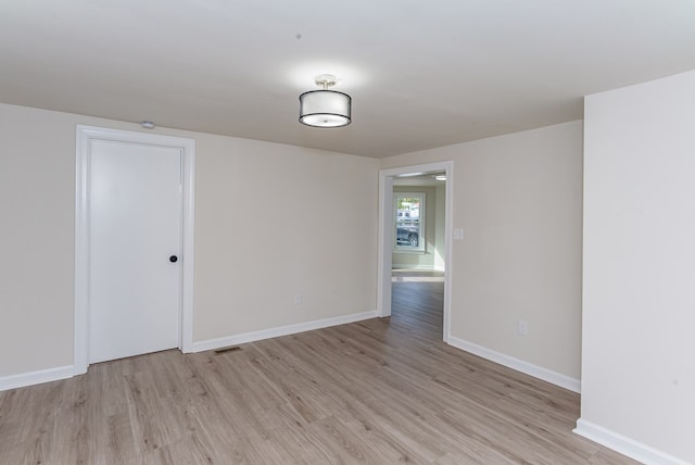 unfurnished room featuring light hardwood / wood-style flooring