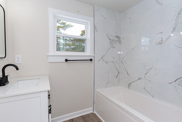 bathroom featuring vanity, hardwood / wood-style floors, and shower / bathing tub combination