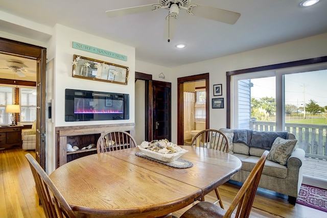 dining room featuring light wood-type flooring and ceiling fan