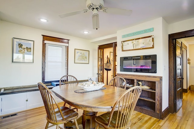 dining room featuring ceiling fan and light wood-type flooring