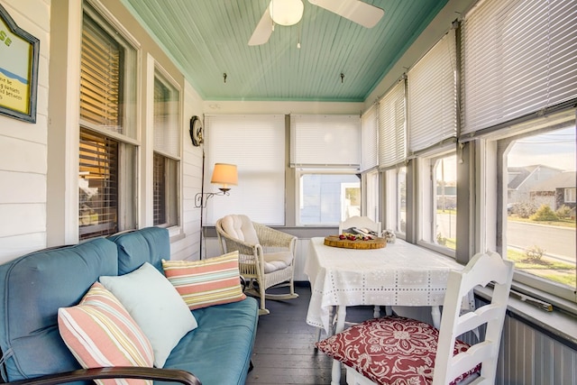 sunroom / solarium featuring ceiling fan