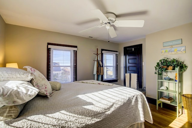 bedroom featuring ceiling fan and dark hardwood / wood-style flooring