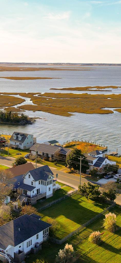 aerial view at dusk with a water view