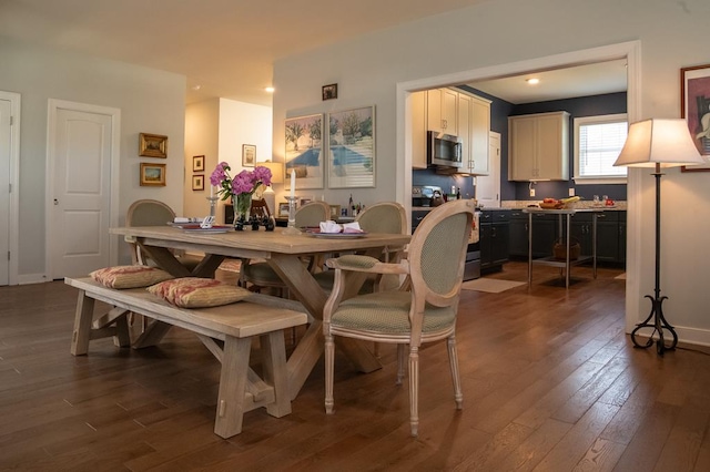 614 Strawberry St, Cape Charles, VA 23310 - dining space with dark wood-style floors and recessed lighting