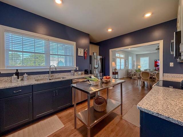 614 Strawberry St, Cape Charles, VA 23310 - kitchen featuring stainless steel appliances, ceiling fan, light wood-type flooring, light stone counters, and recessed lighting