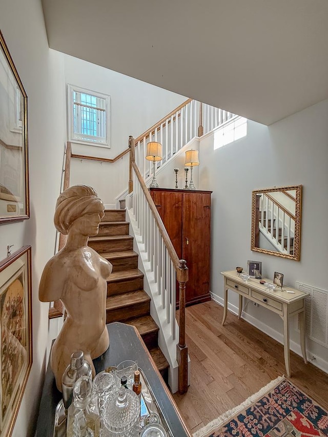 614 Strawberry St, Cape Charles, VA 23310 - stairway featuring wood finished floors